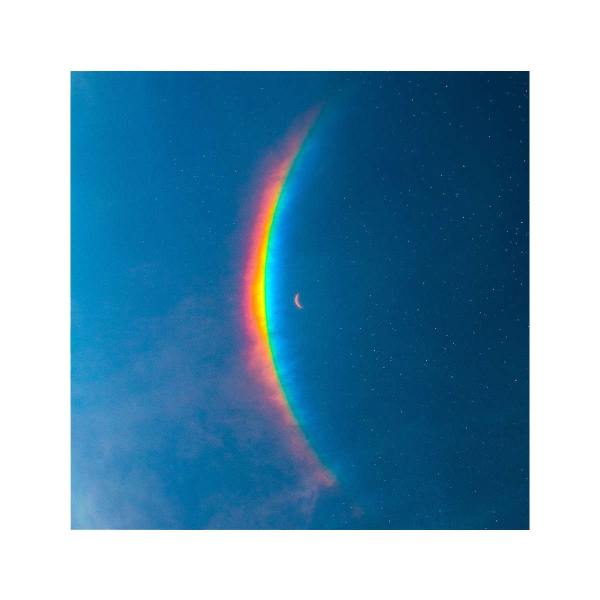 The Moon Music artwork features a crescent moon in the center, with a large, arced rainbow light dispersion to the left. The colors created by the light dispersion flow from red to orange, yellow, green, light&dark blue, on a blue sky filled with stars.