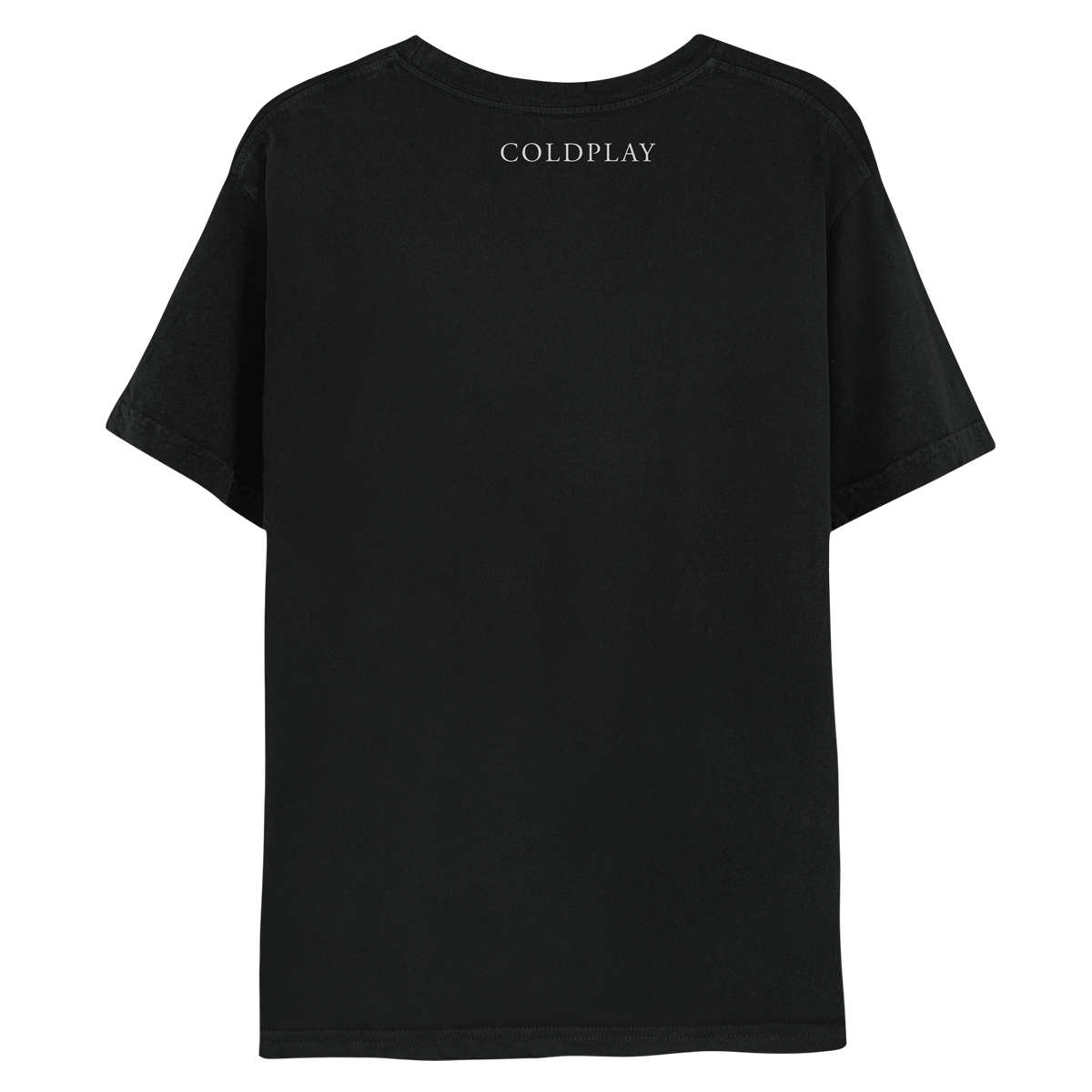 Back: The shirt is black. COLDPLAY is printed in white, just below the neckline. MUSIC OF THE SPHERES is written on the right sleeve. The band name is in a classic, elegant font, with small decorative lines or strokes at the ends of the letters