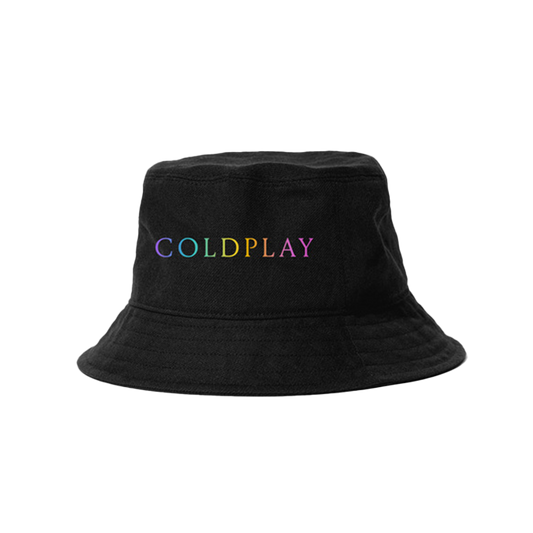 Coldplay embroidered on the front of a black bucket hat in a rainbow gradient. C is lilac, O is teal, L is light green, D is yellow, P is yellow orange, L is orange pink, A is light pink, and Y is dark pink.