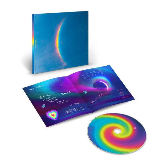 The cover shows a centered🌘with a large, arced rainbow light dispersion to the left. Colors flow from red to orange, yellow, green, light&dark blue on a starry night sky. The CD center is a spiral of blues, pinks, purples, yellows&greens. A hand-written lyric booklet is on the One World page, in blue, purple&pink. It reads:LOOK WITH LOVE,WE ARE ALL ONE IN THE UNIVERSE. We see cartoon faces of all band members, stars, rocket ships, a distant planet, a dove♥1large in colors of a🌈others white&small