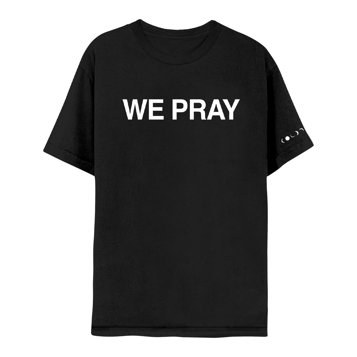 Front: WE PRAY is printed in large, white, bold letters across the chest of a black short sleeve t-shirt. Coldplay is spelled out in white phases of the moon at the hem of the left sleeve.